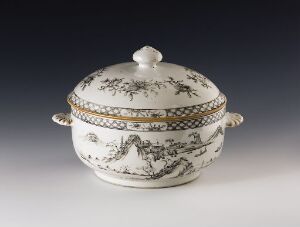  An ornate white porcelain tureen with cobalt blue landscape designs and gold accents, including a bordered lid with a matching round knob.