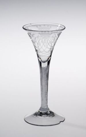  An elegantly designed transparent glass with a conical bowl featuring a diamond pattern, a twisted stem, and a stable circular base, set against a light gray background.