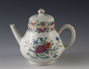  A traditional ceramic teapot with a glossy white finish and colorful painted floral patterns, including pinks, purples, oranges, blues, and shades of green on its surface, featuring a stout spout and a sturdy handle against a neutral gray background. Artist's name and title are unknown.