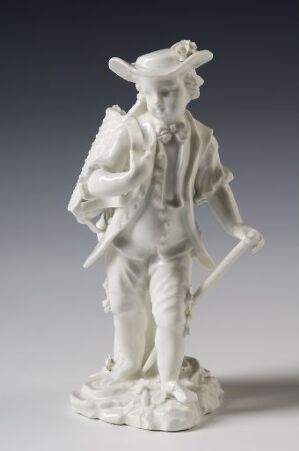  A monochromatic, glossy white porcelain figurine of a male character in