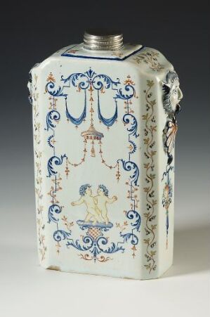  An antique white porcelain flask with blue decorative patterns, featuring a cherub motif and metal mount, possibly from European origin, on a light background.