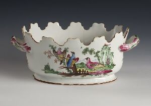  Decorative ceramic container with a scalloped, wavy edge and a painted pastoral scene featuring human figures, trees, and birds in vibrant colors, evoking an 18th or