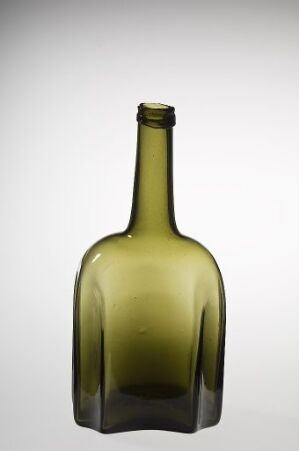  A translucent olive green glass bottle with a tapered neck against a light gray background.