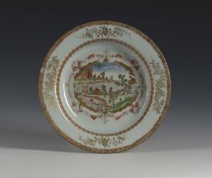  Decorative porcelain plate with a central pastoral painting in muted greens, browns, and blues, bordered by floral motifs and a golden brown trim, displayed against a neutral background.