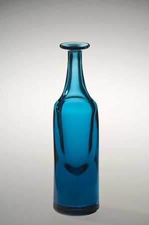  A slender, vibrant blue glass bottle with a glossy surface stands upright against a softly fading grey-to-white background, highlighting the bottle's elegant shape and captivating color. Artistname and title are unknown.