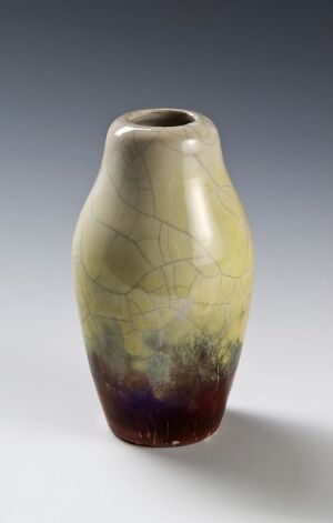  A vase with a slender shape and a slightly flared opening. The vase has a gradient from creamy yellow at the top to deep green, overlaid with a crackled pattern, and transitions to dark brown near the base.