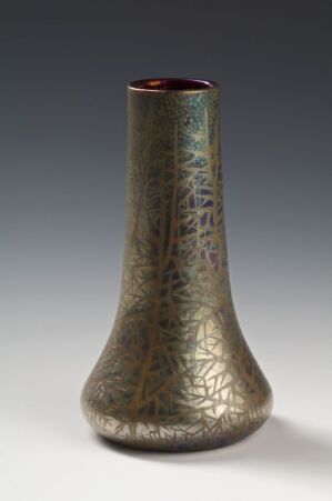  A tall, slender metallic vase with an intricate, etched pattern exhibiting shades of green, bronze, and brown, and a darker maroon interior, against a soft gray gradient background. Artist name and title are unknown.