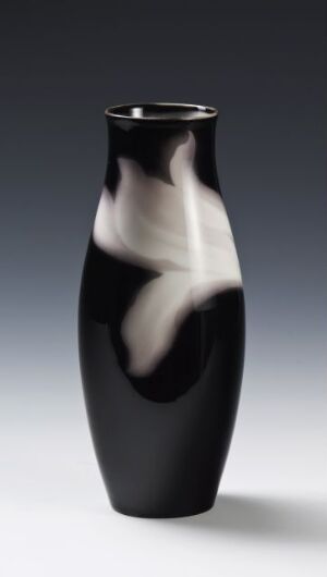  An elegant, high-gloss vase with a deep black color and a swirling white pattern, showcased against a light to dark grey gradient background.