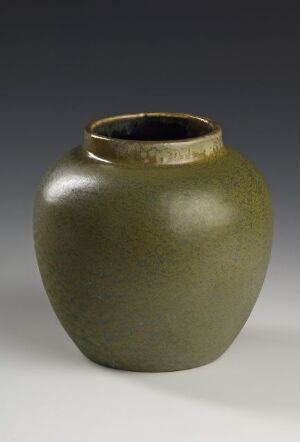  An olive green, rounded ceramic pot with a matte finish and a thin dark-glazed rim at the top, against a backdrop with a light-to-dark gray gradient.