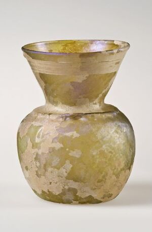  A muted yellow and off-white mottled glass vase with a bulbous base, narrow neck, and flared open mouth, displaying a marbled texture and subtle hints of pink near the rim.