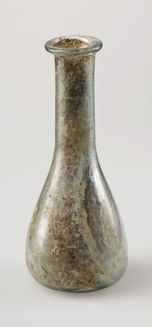  A slender, elongated glass bottle with a narrow neck and flared opening, displaying a silvery, somewhat iridescent finish with slight speckling, on a plain white background. Artist name and title are unknown.