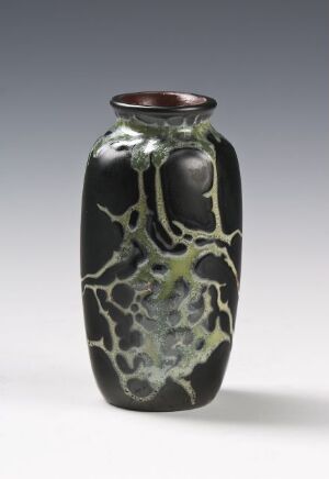  A tall, glossy black ceramic vase with a pale green vein-like pattern and a warm brown rim, displayed against a neutral gray background.