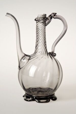  A transparent glass wine decanter with a round body, slender neck, flared spout, and twisted handle, sitting on a light gray background.