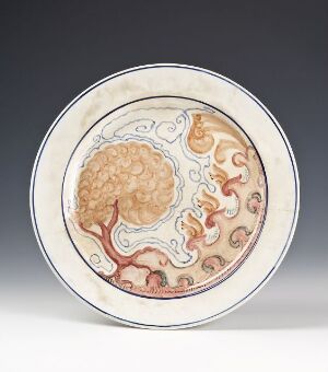  Circular plate with a subtle pastel color palette, featuring a central illustration that resembles a cross-section of a human brain surrounded by flowing organic designs in shades of orange, beige, and peach on a pale cream background.