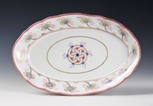  Oval-shaped porcelain platter with a white base and hand-painted, pastel floral decoration on the rim and center, created by Porsgrunds Porselænsfabrik AS.