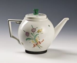  A Thor B. Kielland porcelain teapot, predominantly white with a delicate overglaze decoration of pastel flowers on one side, a contrasting green knob on the lid, and a black line at the base.