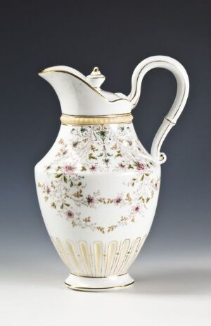  A porcelain jug from Porsgrunds Porselænsfabrik AS featuring a slender design with a broad, fluted base, embellished with scattered floral patterns in soft purples, pinks, and yellows with green leaves, golden accents on the trim, and a fitted lid.