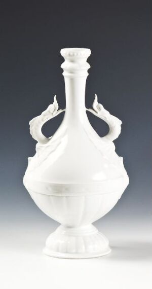  An elegant white porcelain vessel with a lid and twin decorative handles that resemble lyres, set against a light, near-white background.