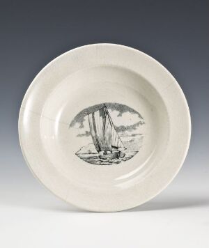  A white glazed ceramic plate with a central black and white drawing of a sailing ship on water, bordered by a broad, plain rim.