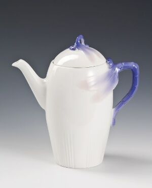  "Trollslända" a feldspathic porcelain coffee pot by Alf Wallander, with a sleek, ribbed, white body and contrasting purple elements on the handle and lid.