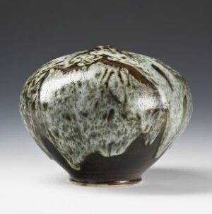  A glazed stoneware vase by Erik Pløen titled "Vase," featuring an organic shape with a glossy brown base transitioning into a patterned cascade of gray, white, and green hues, resembling natural mineral textures.