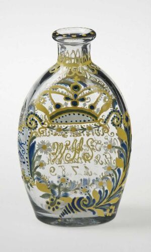  A decorative flask with an elaborate design in gold, navy blue, and shades of green on a white background, featuring ornate baroque-style patterns and floral motifs.