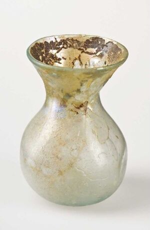  A small decorative glass vase with a rounded body, showcasing a gradient from milky white at the base to translucent gray with ivory marbled patterns, transitioning to clear glass with hints of gold at the neck, and finished with a metallic gold rim.