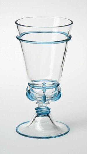  A clear glass vessel with a subtle blue accent on the rim, waist, and foot against a white background.