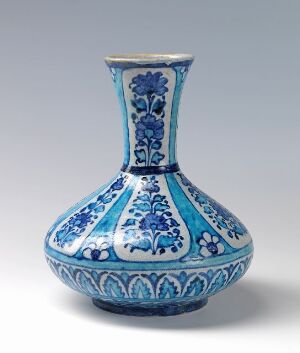  A traditional blue and white porcelain vase with a bulbous base and narrow neck, featuring intricate cobalt blue floral patterns on a white background.