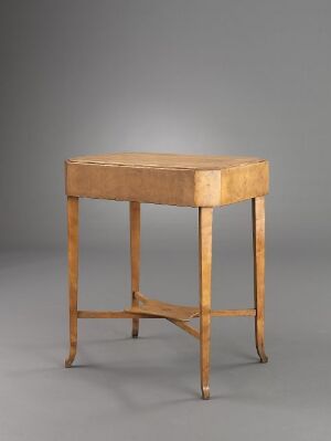  An elegant light brown wooden table with a rectangular top and four slender legs connected by an X-shaped stretcher, set against a neutral gray background.