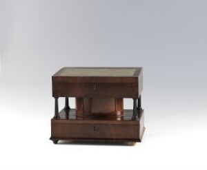  Antique wooden table with a glass top and an open shelf with vertical bars on the sides, set against a light gray gradient background. Artist name and title remain unknown.