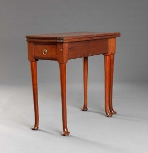  A narrow antique wooden side table with curved legs and a single drawer, set against a light gray background.