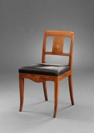  A polished honey-brown wooden chair with a tall, rectangular backrest featuring an inlaid decorative motif, and a dark upholstered seat, set against a gray background.