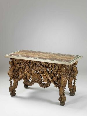  An ornate, Baroque-style table called "Bord" by an unidentified artist, featuring elaborate polymentforgylt gilded pine and lime wood carvings with a polished marble top in white and gray tones.