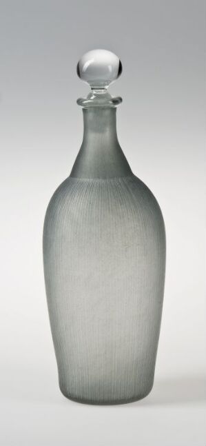  An elegant frosted glass bottle with a cylindrical body, tapering slightly at the top, and a spherical frosted glass stopper, set against a light-gray background.