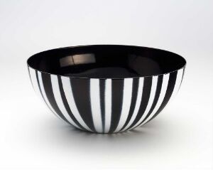  A black and white striped enameled steel bowl designed by Grete Prytz Kittelsen, displaying an alternating pattern of glossy white and matte black vertical stripes.