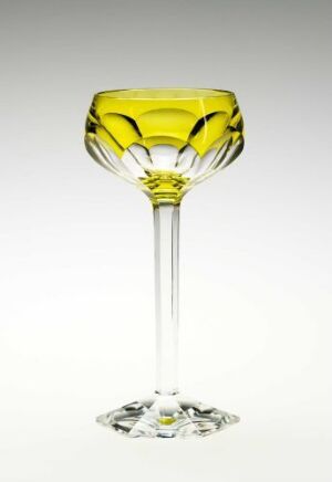  An elegant glass with a yellow-tinted bowl featuring five decorative indentations, a clear stem, and a circular base, set against a soft grey-to-white gradient background.