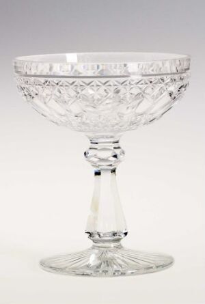  A clear crystal goblet with a cut diamond pattern in the bowl and a decorative, multifaceted stem, set against a light grey background.