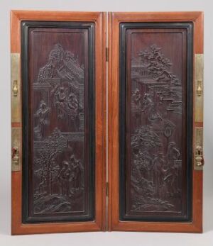  Ornate wooden double doors with detailed carvings on each panel, depicting mythical or historical scenes, framed by a contrasting reddish-brown border and featuring golden hardware.