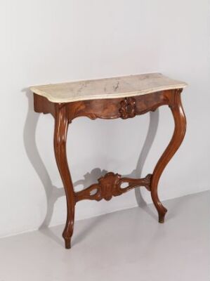  An antique-style wooden console table with gracefully curved legs and a central ornate carving, featuring a lighter beige or off-white marble-like top, against a light background.