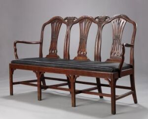  A traditional Chippendale style dining chair set with an armchair and three side chairs connected to each other, all made of dark mahogany wood, featuring ribbon backrests and dark upholstered seats, on a neutral background. Artistname and title are unknown.