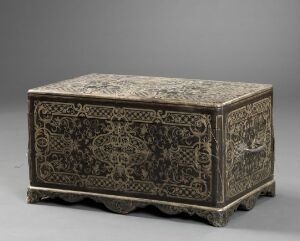  An ornate, antique rectangular chest with dark brown and tarnished gold patterns, displayed on a simple grey background to highlight its intricate design and craftsmanship.