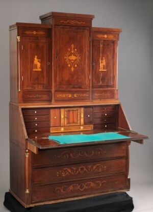  An antique wooden secretary desk with a teal writing surface, adorned with glass-paneled doors, intricate golden inlays, and multiple drawers with golden handles against a gray backdrop. Artistname and title are unknown.