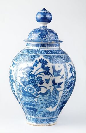  A traditional blue and white porcelain ginger jar with a domed lid and a round handle. The jar is adorned with intricate blue floral and mythical scene designs on a white background.