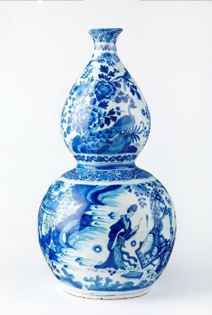  A double-gourd blue and white porcelain vase with intricate aquatic and floral patterns on a white background. The artist's name and title of the piece are unknown.