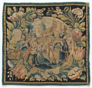  An antique square textile featuring a central oval medallion with a pastoral scene surrounded by stylized, large floral motifs in muted pinks, blues, and beiges on a dark background.