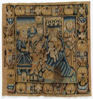  An antique square tapestry depicting a medieval scene with a central figure on a throne-like chair dressed in blue and tan, flanked by a couple and surrounded by various figures and motifs in a bordered framework with earthy tones of ochres, blues, browns, and tans.