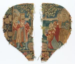  Fragment of an old tapestry with two separate pieces depicting medieval or renaissance scenes with nobility among attendants and courtiers. The left shows a crowned male with courtiers in red, blue, and gold clothing, while the right shows a seated woman in red with two figures presenting her with a gift in a garden-like backdrop with floral motifs.