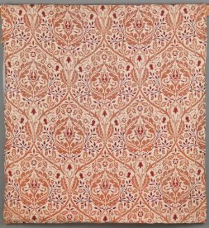  A handwoven silk and linen fabric by William Morris titled "Golden Bough," featuring a symmetrical, botanical-themed pattern with intricate intertwining shapes in shades of orange, coral, and pink against an off-white background, exemplifying the Arts and Crafts movement's style.