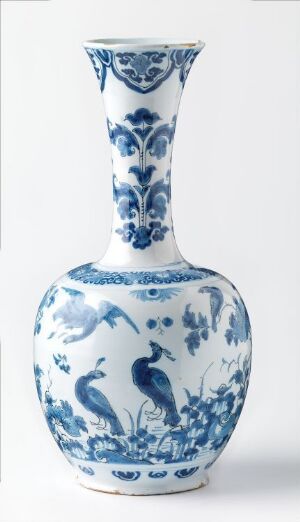  A blue and white porcelain vase with intricate designs and a flared trumpet-shaped mouth on a white background. The vase features traditional cobalt blue motifs against a white glaze, with no visible damage, and an overall elegant appearance.